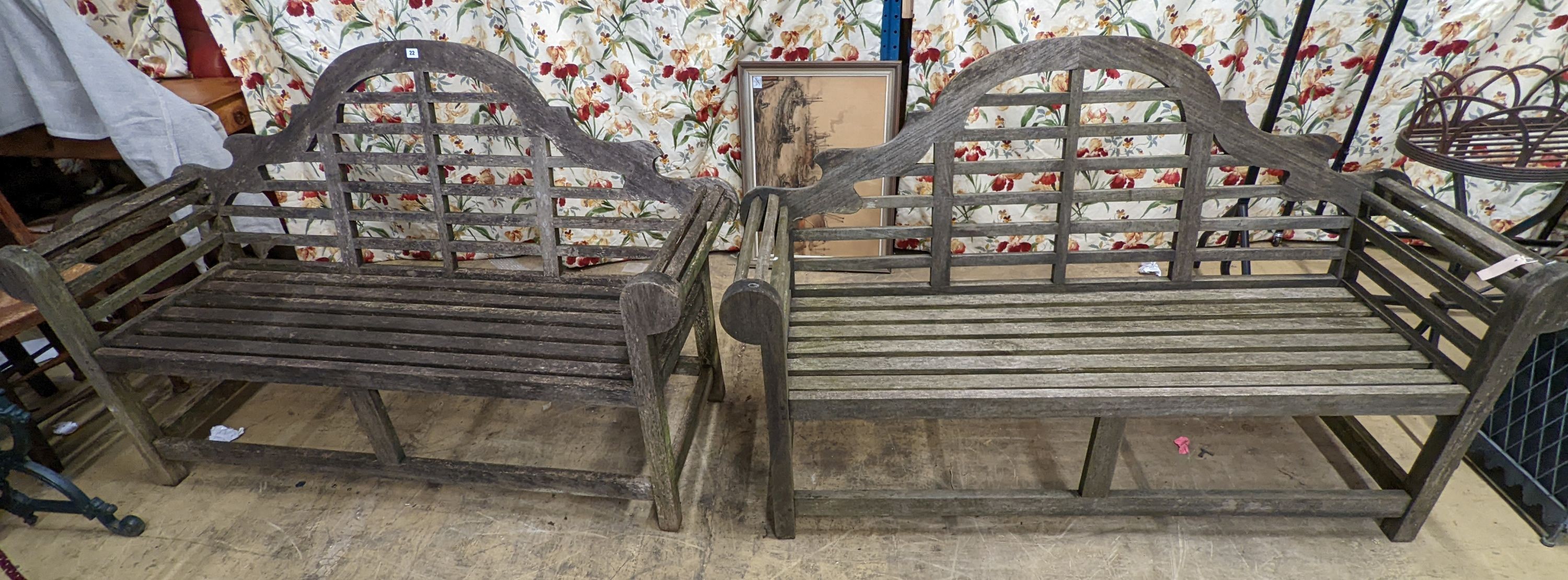 A pair of Lutyens style weathered teak garden benches, length 166cm, depth 53cm, height 105cm